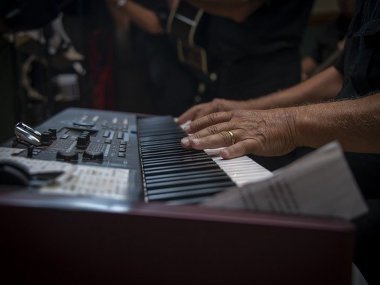 Person playing wireless digital piano