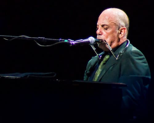 Billy Joel playing the harmonica